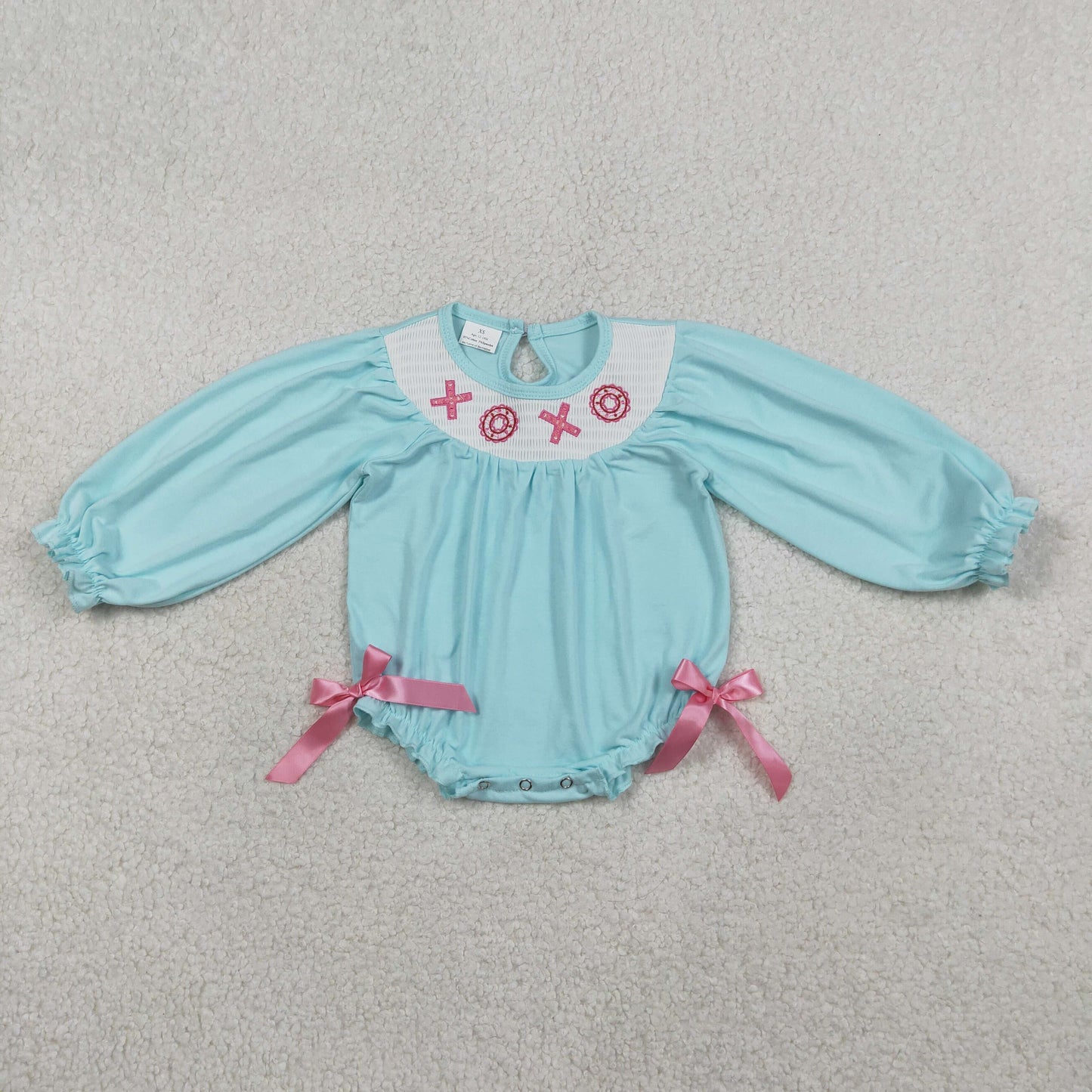 LR2982 Smocked XOXO Baby Girls Long Ruffle Sleeve Valentines Rompers
