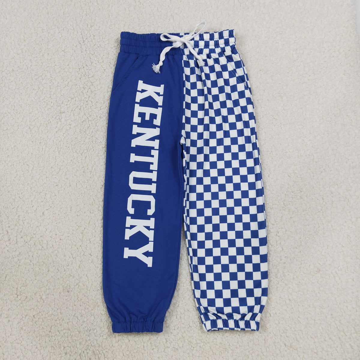 P1059 Baby Boys Blue Checked Vinyl Kentucky Team Pockets Joggers Bottom